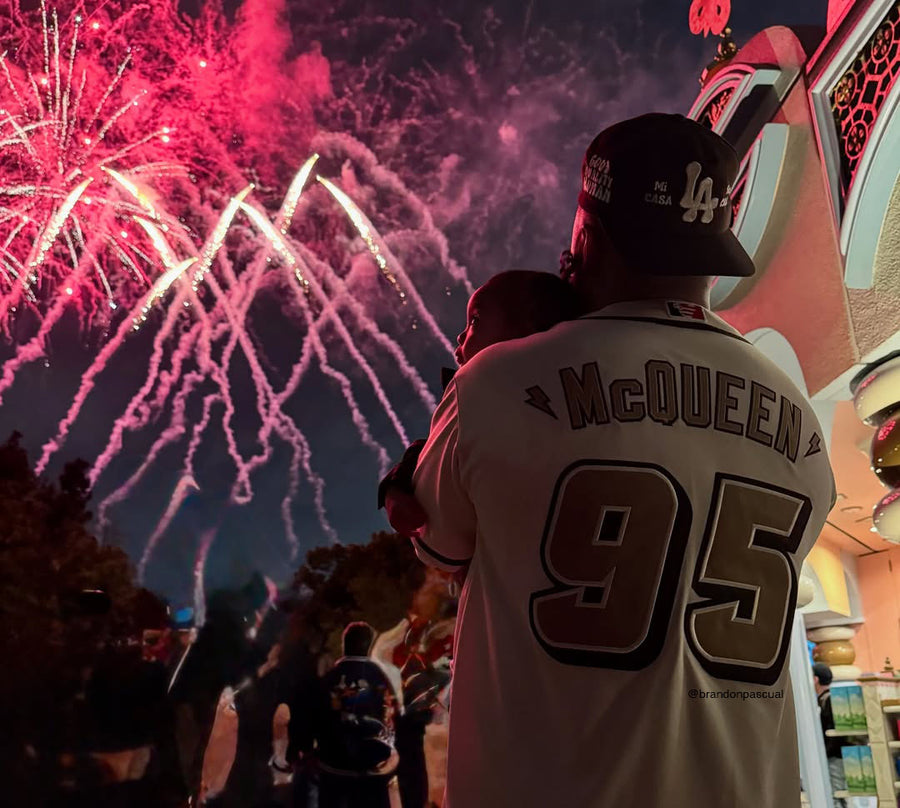 Man watching fireworks wearing Good Quality Human's Mi Casa Su Casa Hat