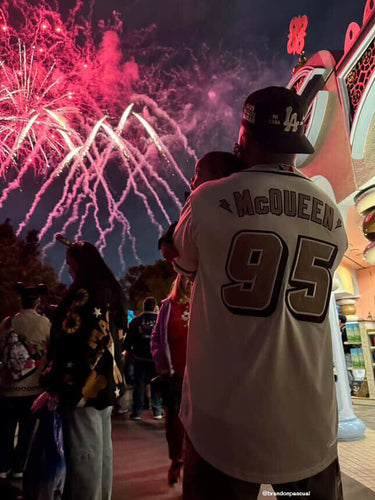 Man watching fireworks wearing Good Quality Human's Mi Casa Su Casa Hat